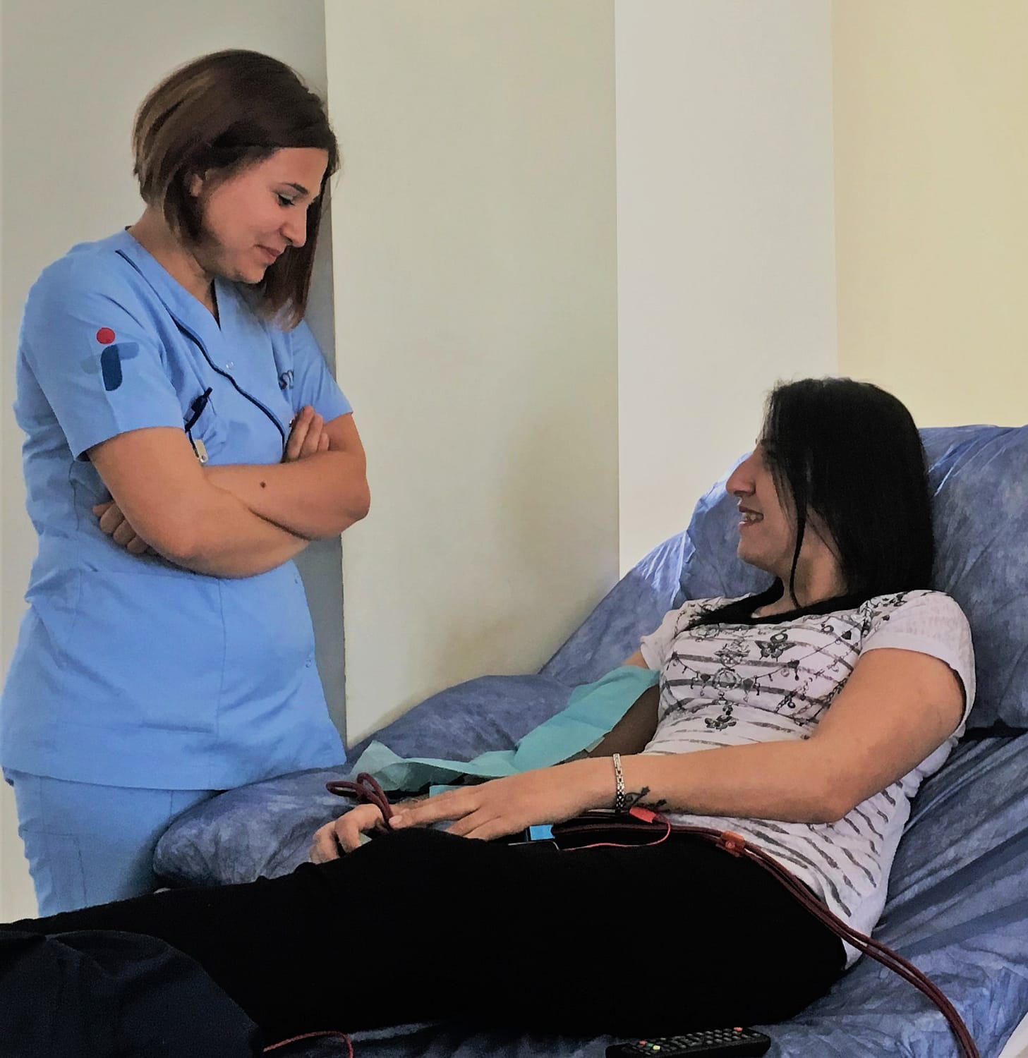 Hilal, a dialysis patient being treated by a nurse working at D.med healthcare.